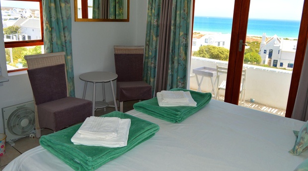 The Self Cater main bedroom with its balcony and panoramic sea view